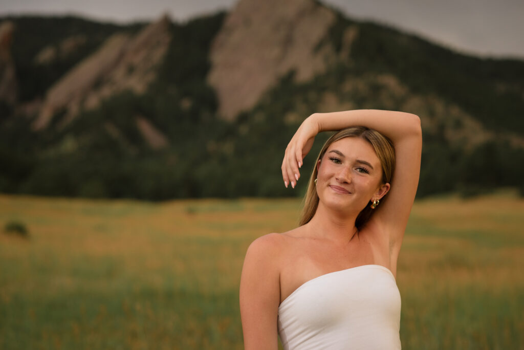 Colorado senior photography at Chautauqua Park in Boulder with a Castle View High School senior enjoying golden hour beneath the Flatirons.